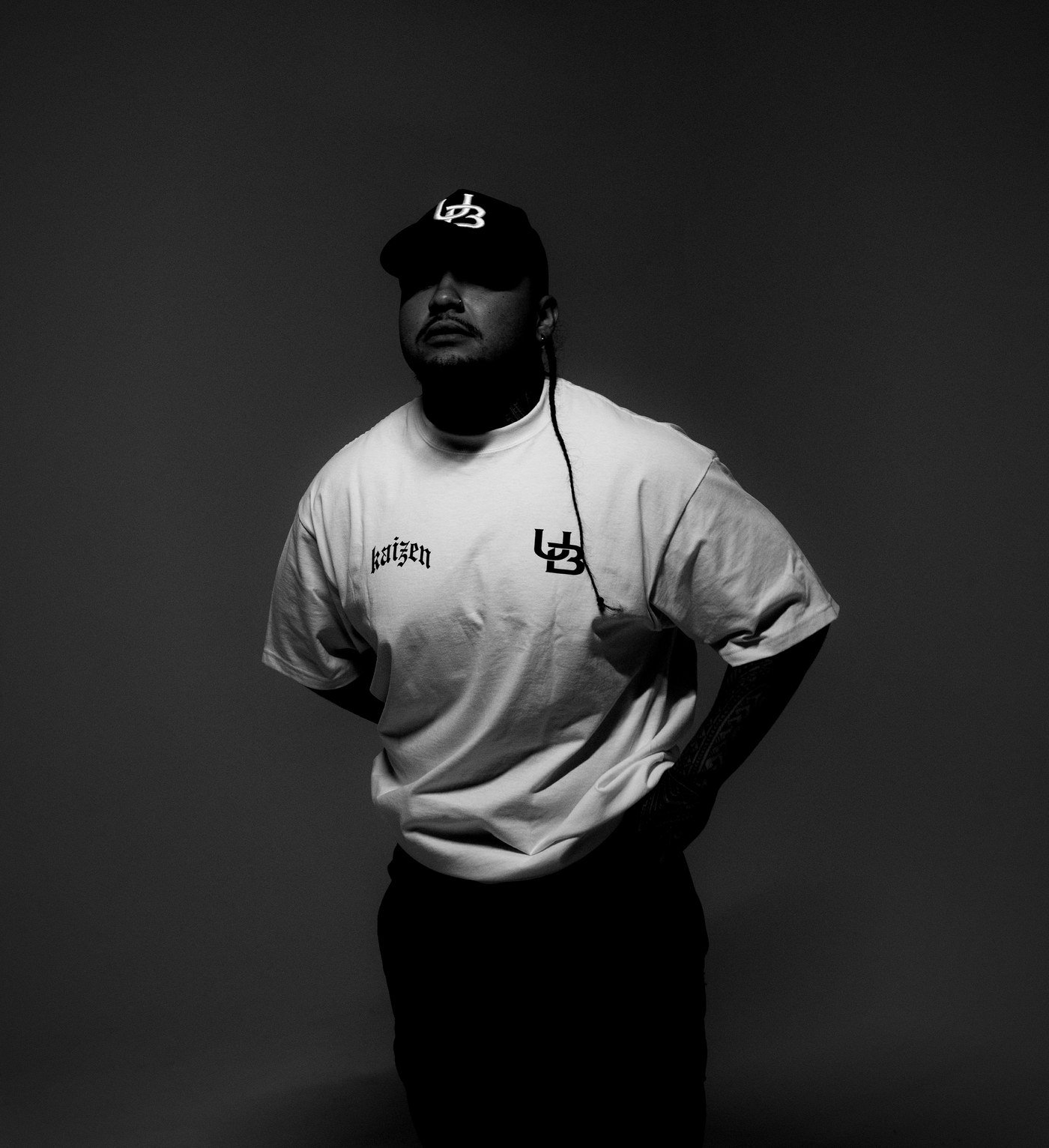 UNKWN Athletics athlete wearing the Kaizen Tee and UB cap